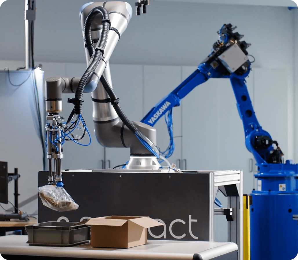 Robotic arms in industrial setting showing automation and efficiency
