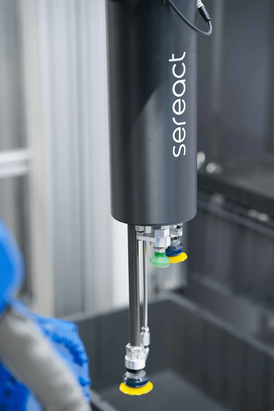 Robotic arm with multiple grippers picking items